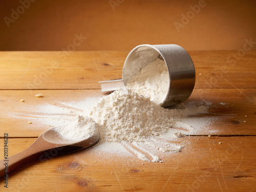 Spilled flour on a wooden table, pastries food, raw material