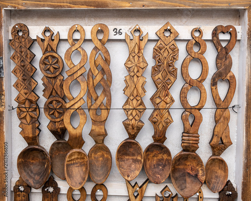 Foto Wooden spoons made of natural wood on burlap fabric