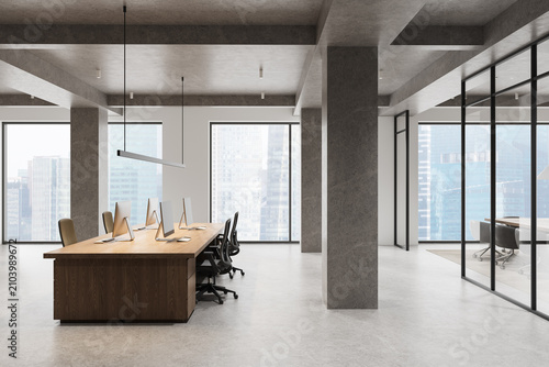 Modern open‑plan office interior with minimalist furniture, large windows, concrete columns, and sleek workstations overlooking a city skyline. 3D Rendering