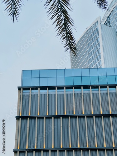 Картината върху платно Abstract detail of modern skyscraper facade with vertical metal louvers and blue