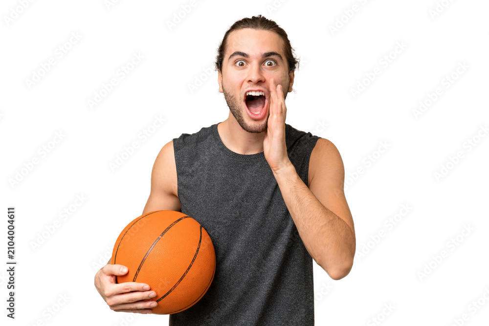 Obraz premium Young basketball player man over isolated background with surprise and shocked facial expression