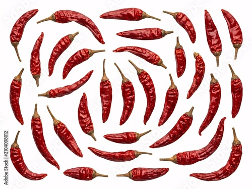 Pattern of dried red chili peppers isolated on white background