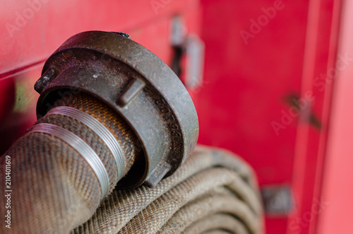 Obraz na plátně A fire hose coupling and hose assembly stored inside a fire station cabinet on board an offshore support vessel