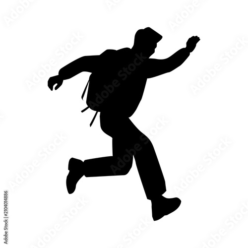Silhouette of a young backpacker jumping