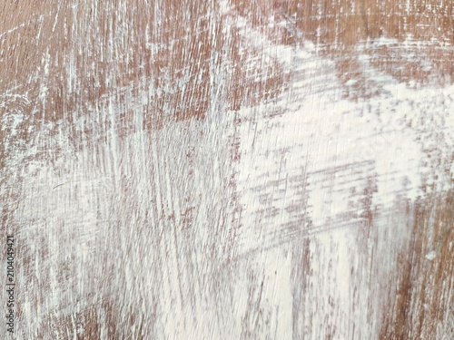 A high-quality distressed wood texture featuring aged, weathered wooden planks with natural cracks, scratches, worn paint, and rustic grain details. This vintage wooden background is ideal for graphic