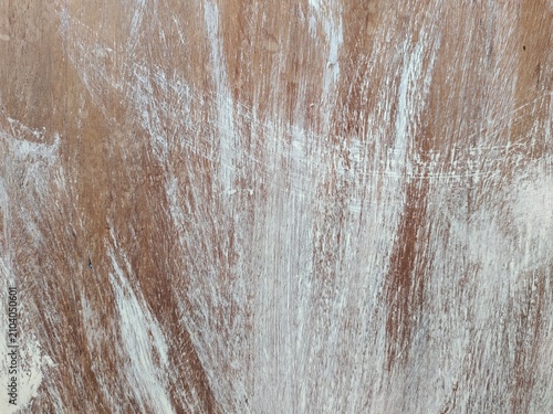 A high-quality distressed wood texture featuring aged, weathered wooden planks with natural cracks, scratches, worn paint, and rustic grain details. This vintage wooden background is ideal for graphic