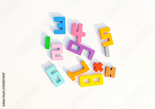 Colorful Wooden Number Blocks Scattered on White Background