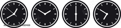 Four black clock faces showing different times of day