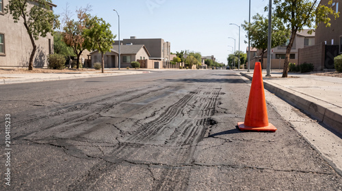 Cuadro en lienzo Damaged asphalt road with traffic cone during extreme summer heat, heat wave cau