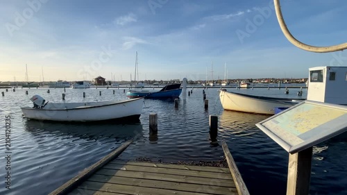 Boats tied to pier during extreme high waters, Faaborg, Denmark