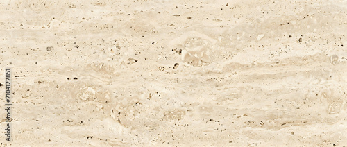 Marble texture displaying a beautiful polished beige travertine mineral surface with detailed horizontal organic layers provides a luxury natural backdrop for creative design templates
