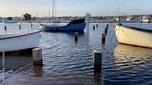 Boats tied to pier under water, Faaborg, Denmark