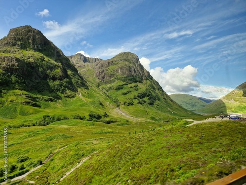Beautiful green highland landscape on a sunny day in Glencoe, Scotland