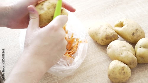 Peeling Fresh Potatoes During Food Preparation in Home Kitchen, 4K