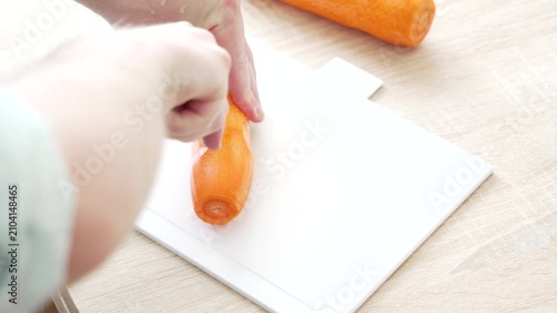 Chopping Carrot into Large Pieces During Food Preparation in Home Kitchen, 4K