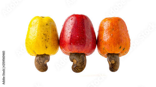 Three Ripe Cashew Apples Yellow Red and Orange Color with Raw Nuts Isolated on White Background