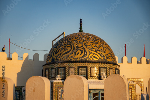 Obraz na płótnie Dome painted with stylized Arabic script in gold, in Kairouan, Tunisia