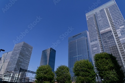 Modern skyscrapers rising above the Yaesu business district in central Tokyo, Japan, symbolizing economic growth, corporate headquarters, financial power and contemporary urban architecture 