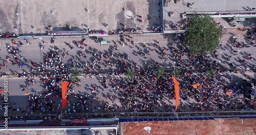 Drone top view of massive people marching and celebrating during immersion of lord Ganesha
