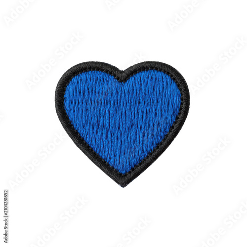 A single vibrant royal blue heart-shaped embroidered patch with fine thread work and black outline, macro shot on a transparent background with soft studio lighting, craftsmanship concept