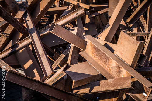Pile of Rusty Industrial Metal Scraps: Beams, Channels, and Angles Discarded