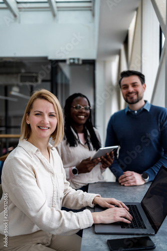 Team members working together in a modern office space during the day