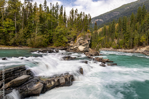 Photography Powerful Rearguard Falls on the turquoise Fraser River, surrounded by evergreen