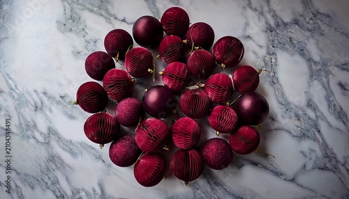 Cluster Of Deep Burgundy Velvet Ornaments On A Marble Surface Background