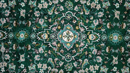 Traditional Green Carpet with Intricate Floral and Geometric Medallion Design