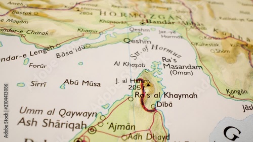 strait of hormuz on detailed atlas map, gliding close up over