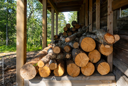 Canvastavla Sarna, Sweden  A pile of chopped pine trees in the Fulufjallet National Park on a porch to be used for firewood