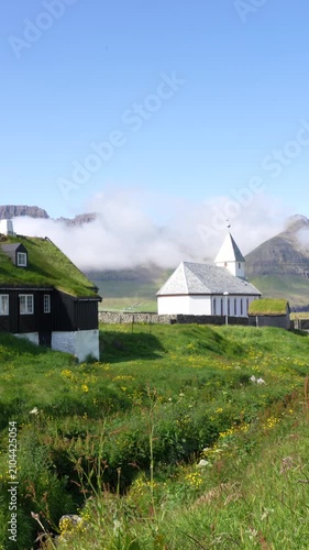 The Viðareiði Church, Faroe Islands in Summer. Vertical Footage