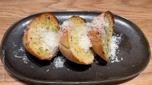 Garlic Bread Served in Plate in Restaurant