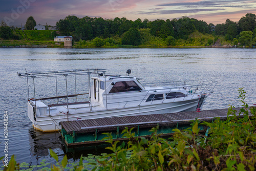 Photos White Motorboat Docked At Wooden Pier