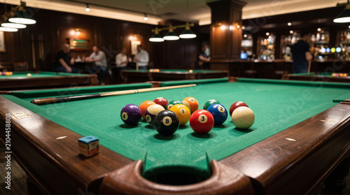 Fotografie Pool Game Setup on Green Table in a Classic Bar Environment