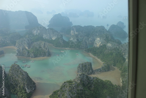 Aerial view of halong bay karst rock formations landscape in vietnam hazy weather.