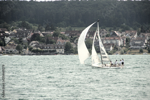 Quadro su tela Yacht with spinnaker on Lake Constance