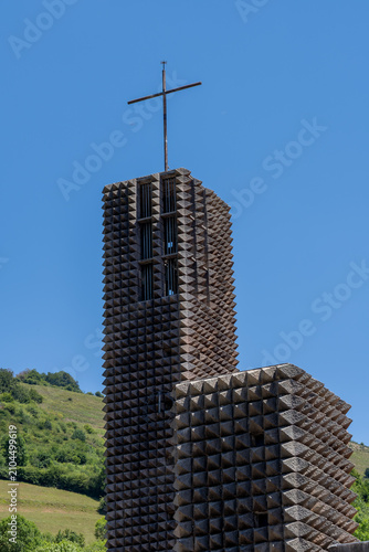 Konstfotografi A vertical low angle view of the modernist architecture and stone diamond-pointed facade of the Sanctuary of Arantzazu basilica in Onati, Basque Country, Spain