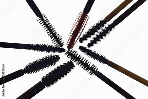 Bild auf Leinwand A composition of various mascara brushes arranged in  circular shape isolated on