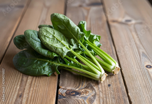 Two fresh spinach bunches o...