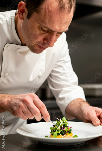 Professional chef carefully...