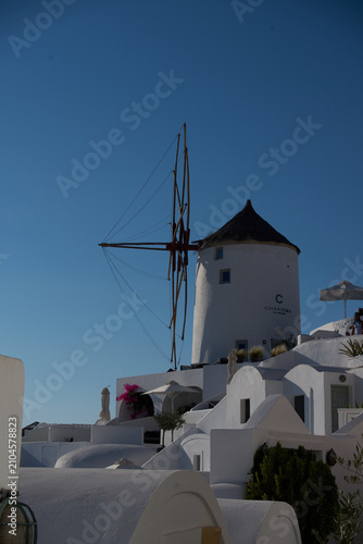 Traditional white Greek windmill overlooking Aegean Sea