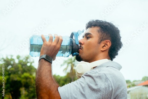 Принти на полотні Healthy man hydrating after intense physical training