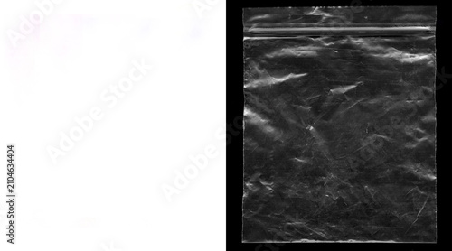 Bild auf Leinwand Transparent plastic bag texture on black background, wrinkled polyethylene zip b