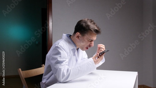 Canvastavla Healthcare professional experiencing frustration and stress while aggressively u