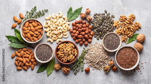 Assorted healthy nuts and seeds flat lay. Organic superfood ingredients for vegan diet.