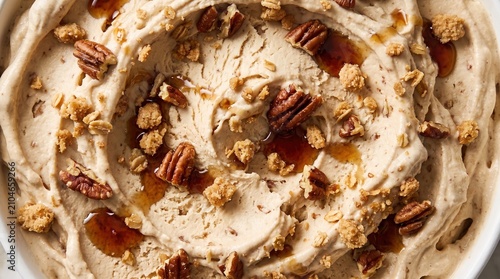 Close up texture of maple syrup ice cream with pecan nuts and crunchy granola toppings