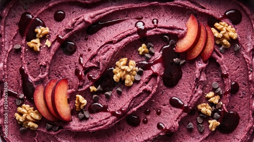 Close up texture of plum sorbet with fresh plum slices, walnuts and chocolate chips