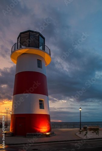 Puntarenas, Costa Rica, Lighthouse by the sea at sunset, scenic view, serene atmosphere, perfect for travel and adventure photography