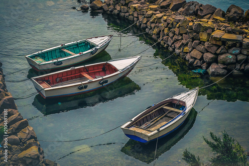 Taquile Island, Peru, Titicaca lagoon, Boats in canal, serene, peaceful, calm, tranquil, nature, landscape, water, reflection, dock, stone, rocks, docked, calm, peace